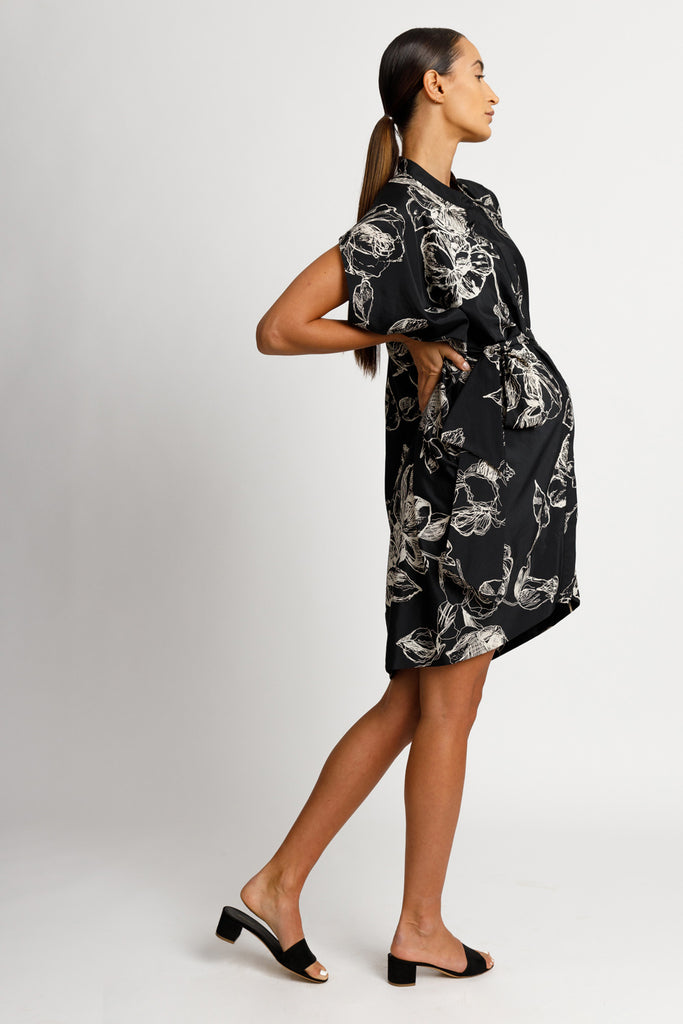 FORMERLY YAN Maternity Figure Flattering Button Down Shirt Dress with Cap Sleeves and Self Tie. Knee Length. Black Floral Print. Adjustable to Wear During and After Pregnancy. Nursing Friendly