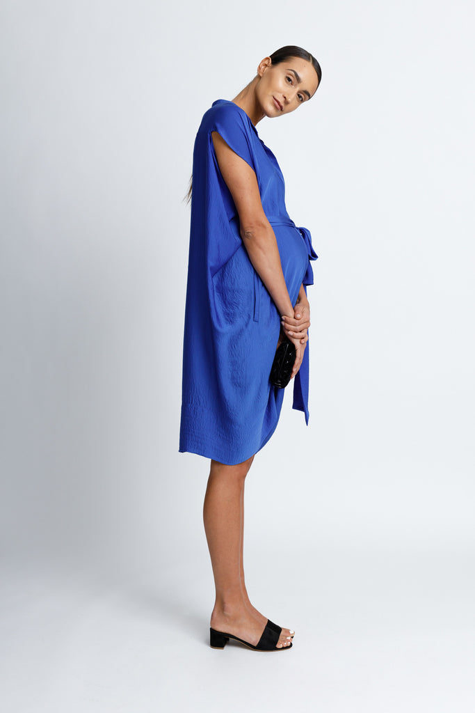 FORMERLY YAN Maternity Figure Flattering Button Down Shirt Dress with Cap Sleeves and Self Tie. Knee Length. Cobalt. Adjustable to Wear During and After Pregnancy. Nursing Friendly