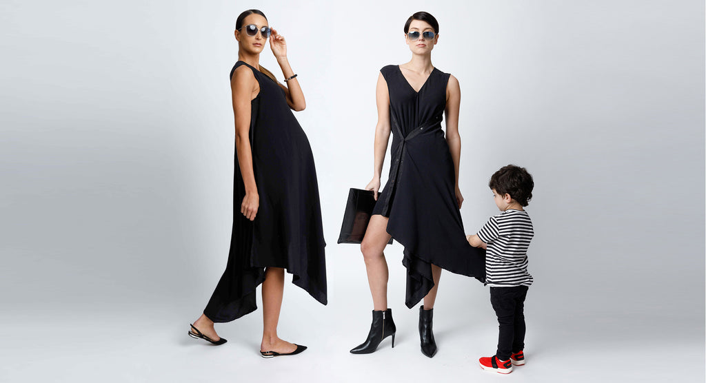FORMERLY YAN Sleeveless V-Neck Midi Snap Dress with Asymmetrical Hem in Black Crepe Back Satin Convertible to Wear During and After Pregnancy