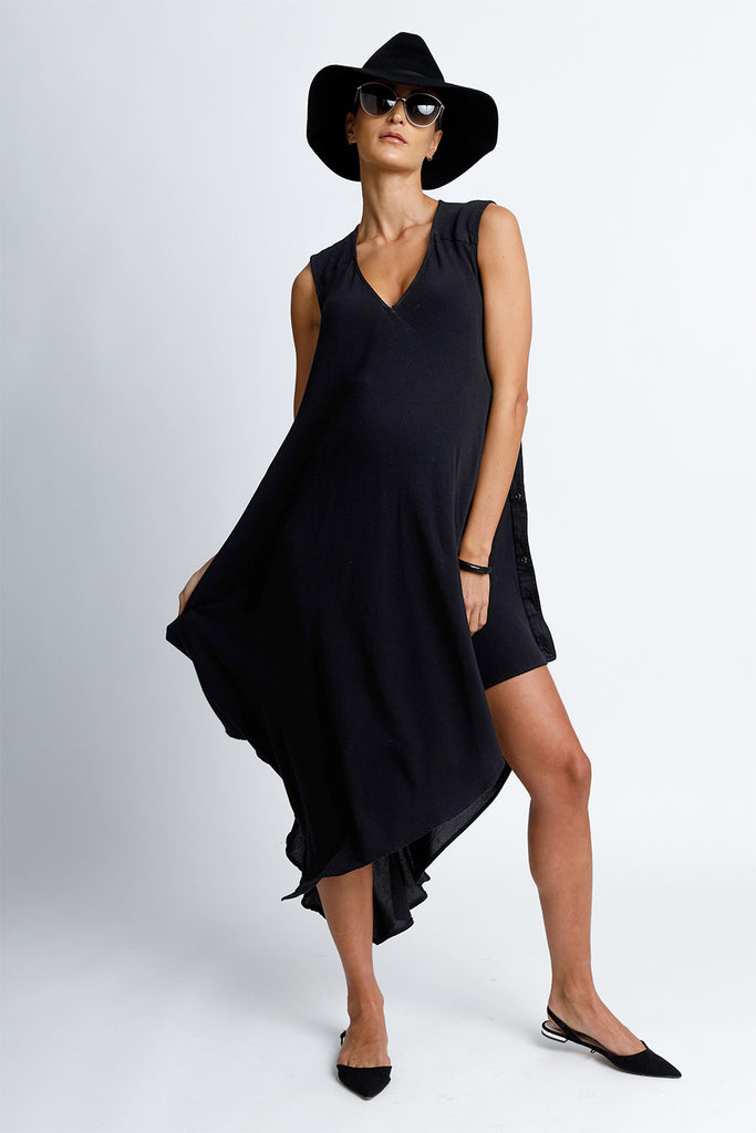 FORMERLY YAN Sleeveless V-Neck Midi Maternity Snap Dress with Asymmetrical Hem in Black Crepe Back Satin Convertible to Wear After Pregnancy