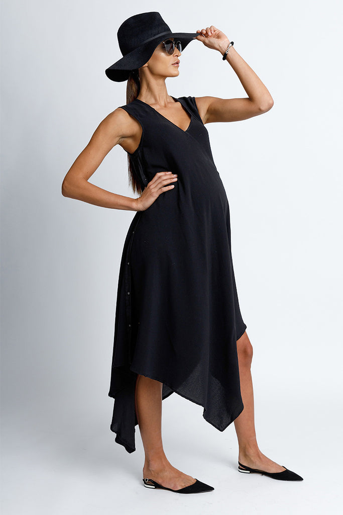FORMERLY YAN Sleeveless V-Neck Midi Maternity Snap Dress With Asymmetrical Hem in Black Crepe Back Satin Convertible to Wear After Pregnancy